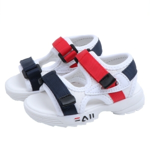Sandalia blanca con suela flexible y cierres de velcro rojos y negros