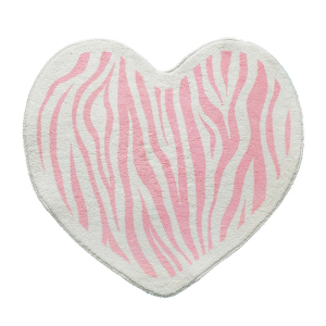 Una alfombra blanca y rosa en forma de corazón para el dormitorio de una niña, con estampado de cebra.